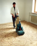Laying parquet flooring tiles